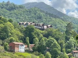 a large house on the side of a mountain at Hotel Cerro La Nina in Beceña