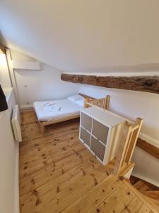 Posteľ alebo postele v izbe v ubytovaní Maison de ville des Arènes + 4 fotografie