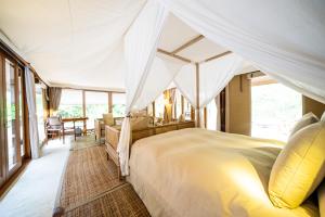 Postel nebo postele na pokoji v ubytování KEIKOKU GLAMPING TENT