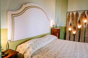 Postel nebo postele na pokoji v ubytování Agriturismo Bio Fattoria di Pietra