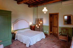 Postel nebo postele na pokoji v ubytování Agriturismo Bio Fattoria di Pietra