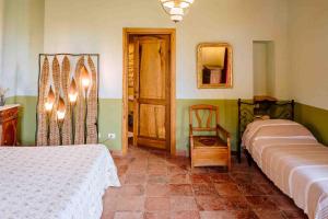 Postel nebo postele na pokoji v ubytování Agriturismo Bio Fattoria di Pietra