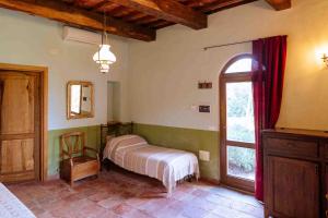 Postel nebo postele na pokoji v ubytování Agriturismo Bio Fattoria di Pietra