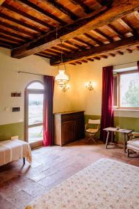 Postel nebo postele na pokoji v ubytování Agriturismo Bio Fattoria di Pietra