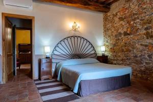 Postel nebo postele na pokoji v ubytování Agriturismo Bio Fattoria di Pietra