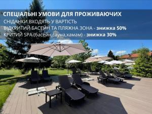 a group of chairs and umbrellas on a patio at Platium Spa&Resort in Kozin