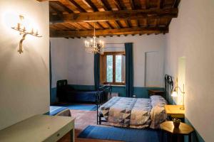 Postel nebo postele na pokoji v ubytování Agriturismo Bio Fattoria di Pietra