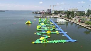 a row of inflatable boats in the water at DelSool Mamaia in Mamaia