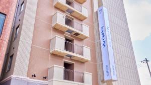 a building with balconies on the side of it at Toyoko Inn Okinawa Naha Kokusai-dori Miebashi-eki in Naha +38 photos