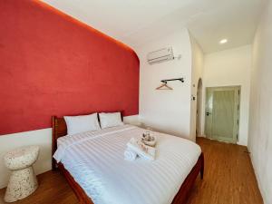 Ein Bett oder Betten in einem Zimmer der Unterkunft Renjana Beach House