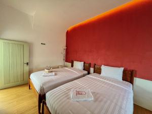 Ein Bett oder Betten in einem Zimmer der Unterkunft Renjana Beach House