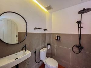 Ein Badezimmer in der Unterkunft Renjana Beach House