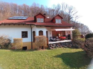 a house with a roof with solar panels on it at Casa Valentina 