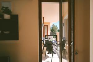 a view of a balcony with a table and chairs at Golden Sands - Two Bedroom apartment on the beach in Golden Sands