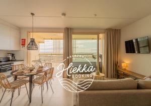 a living room with a couch and a table at Marina Resort Apartments by Hiekka Booking in Kalajoki