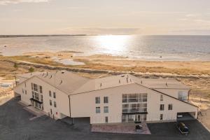 an aerial view of a building next to the ocean at Marina Resort Apartments by Hiekka Booking in Kalajoki +108 photos