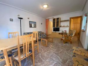 Televízia a/alebo spoločenská miestnosť v ubytovaní appartement plage des naufragés