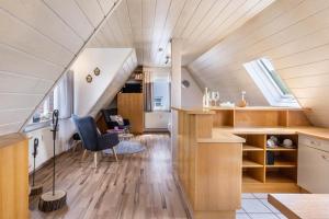 an attic kitchen and living room in a house at Apartment Allerliebst in Albstadt