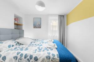 Ένα ή περισσότερα κρεβάτια σε δωμάτιο στο Apartment Sunny Sky