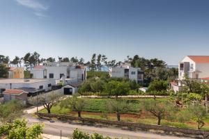 a view of a city with houses at Apartment Aria 150 meters from the beach - by TA Leut agency in Privlaka