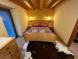 A bed or beds in a room at Grandze du Pleiney
