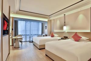Letto o letti in una camera di SSAW Boutique Hotel Yingyang