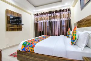 Postel nebo postele na pokoji v ubytování FabHotel The Eden + 23 fotografií