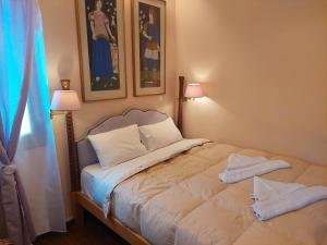 Postel nebo postele na pokoji v ubytování Kalypso Home F