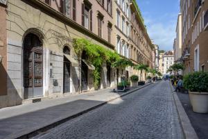 a cobblestone street in a city with buildings at Casa Violante Luxury Apartment in Rome