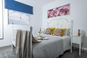 Posteľ alebo postele v izbe v ubytovaní Casa Virginia Corralejo by iRent Fuerteventura