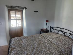 Postel nebo postele na pokoji v ubytování Les chambres de la Bastide