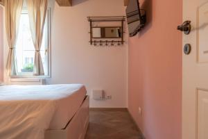 Postel nebo postele na pokoji v ubytování Le camere di Olivia