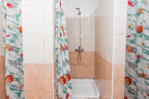a bathroom with a shower with a toilet in it at HI Hostel Dubrovnik in Dubrovnik