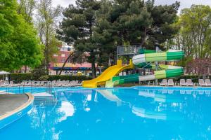 a water slide in a pool at a resort at iHotel Sunny Beach in Sunny Beach +47 photos