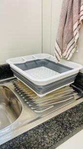 a tray sitting on top of a sink in a kitchen at La Lucia Sleepover in Durban