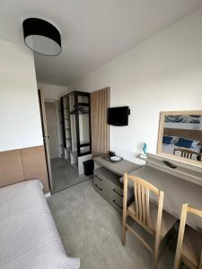a bedroom with a desk and a bed and a desk and chair at Antylia1 in Władysławowo