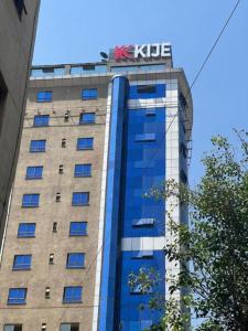a building with a kle sign on top of it at Kije Place Hotel in Nairobi