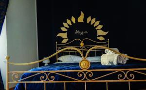 A bed or beds in a room at Camurria Sicilian B&B