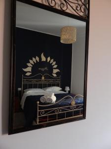A bed or beds in a room at Camurria Sicilian B&B