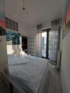 Кровать или кровати в номере Apartment Ksiecia Witolda 43