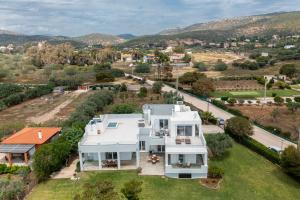 an aerial view of a white house at Legrena Beach House in Sounio