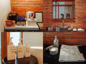 a bathroom with a sink and a brick wall at Sala Ayutthaya in Phra Nakhon Si Ayutthaya