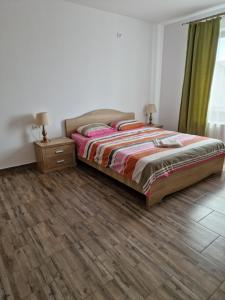 Postel nebo postele na pokoji v ubytování Sunshine Apartments