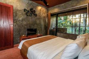 Postel nebo postele na pokoji v ubytování Daydream Lodge Tegallalang + 40 fotografií