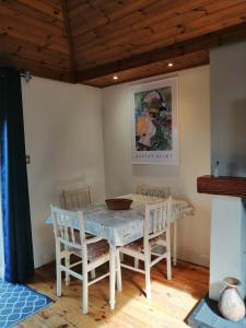 a dining room with a table and chairs at An Cúinín in New Ross