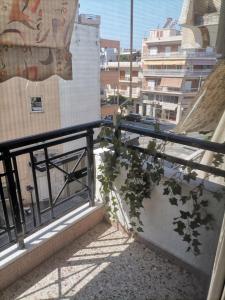 a balcony with plants on the side of a building at Vaso holidays in Alexandroupoli