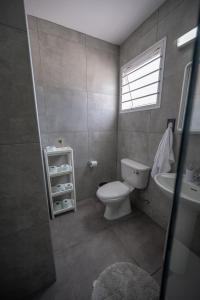 a bathroom with a toilet and a sink at Nissi avenue studio in Ayia Napa