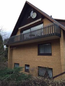 a building with a balcony on top of it at Ferienwohnungen Matthias Schröder in Bad Bevensen