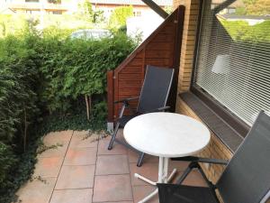 a table and two chairs on a patio at Ferienwohnungen Matthias Schröder in Bad Bevensen