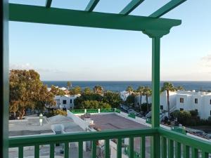a balcony with a view of the ocean at Molino de Guatiza in Costa Teguise